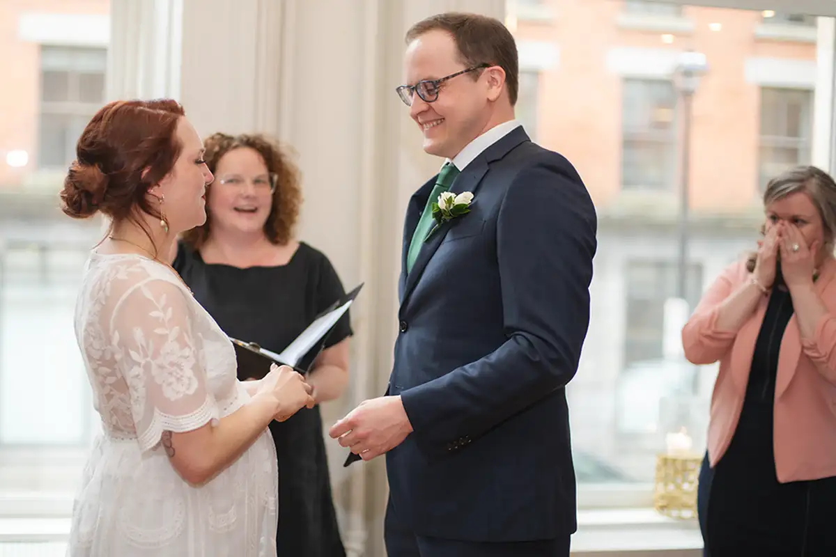 Couple exchanging vows during intimate wedding ceremony in Halifax, Nova Scotia